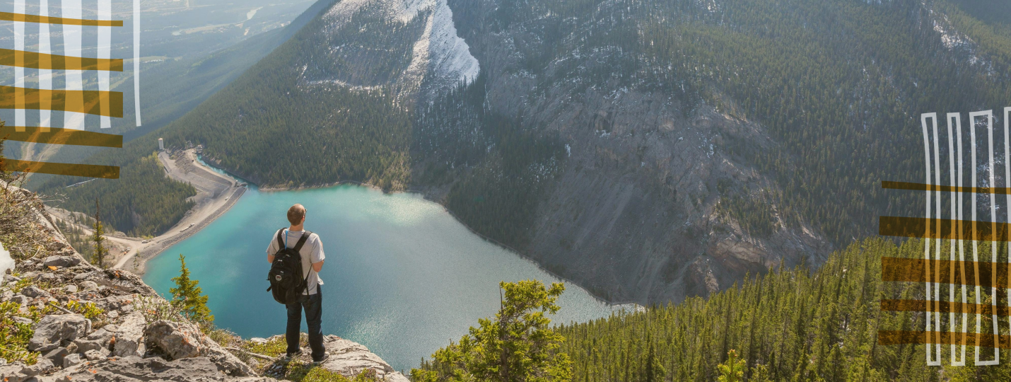 Living in Canada vs USA, A backpacker standing and looking at the view in Canada